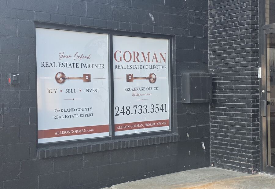 Perforated window graphics for a real estate office storefront &mdash; Savers Printing